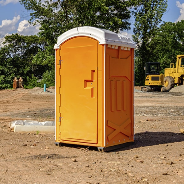 what is the cost difference between standard and deluxe portable restroom rentals in Moniteau County